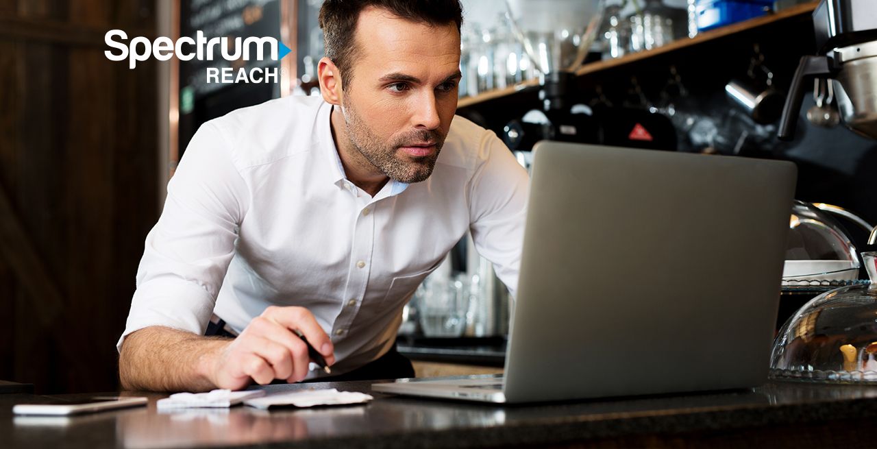 Small business owner working on his laptop 